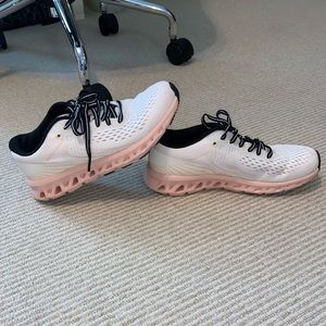 pink, white, and black running shoes